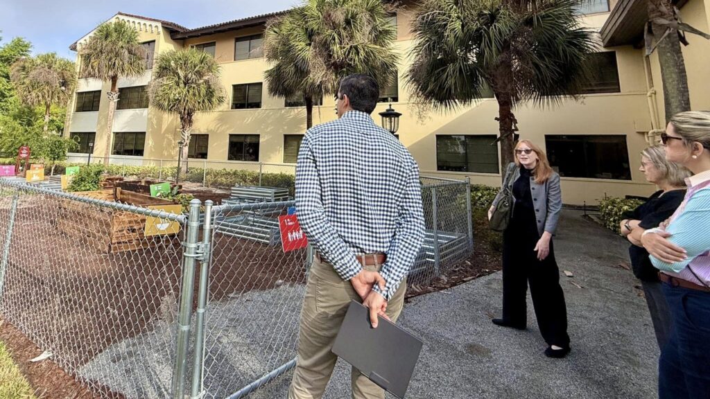 President Nick Abarahams at Rollins College Urban Farm.